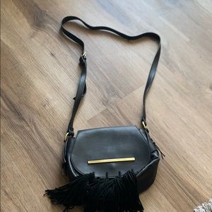 A black Steve Madden purse